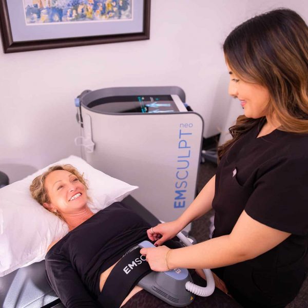 Licensed provider performing Emsculpt Neo core strengthening treatment on patient in Santa Barbara