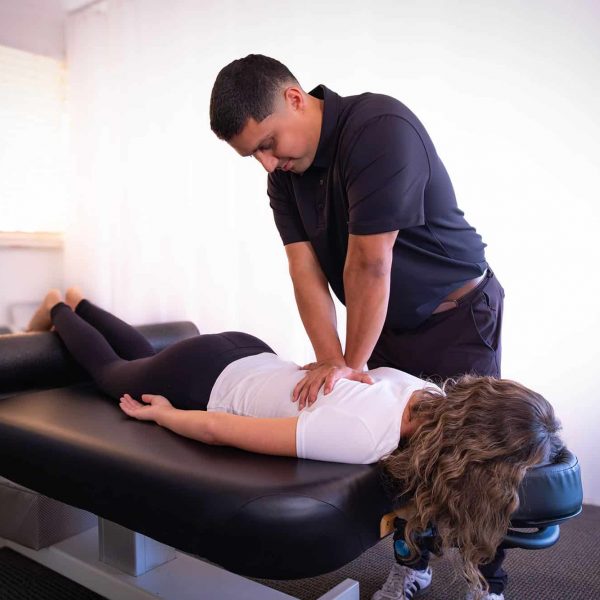 Physical therapist performing hands-on manual therapy for lower back pain treatment in Santa Barbara
